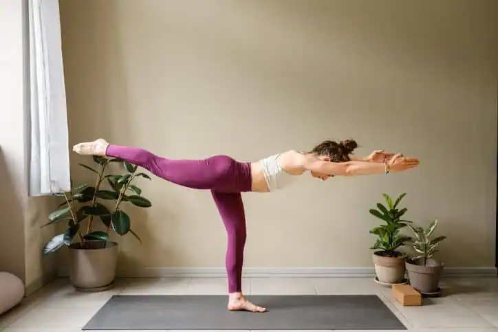Achieving the Perfect Tone: How Often Should You Exercise for Results? 1 Woman doing Yoga exercise Edgware to help with toning the body.
